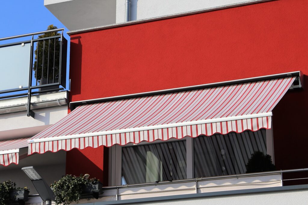 New balcony awning with red and white stripes